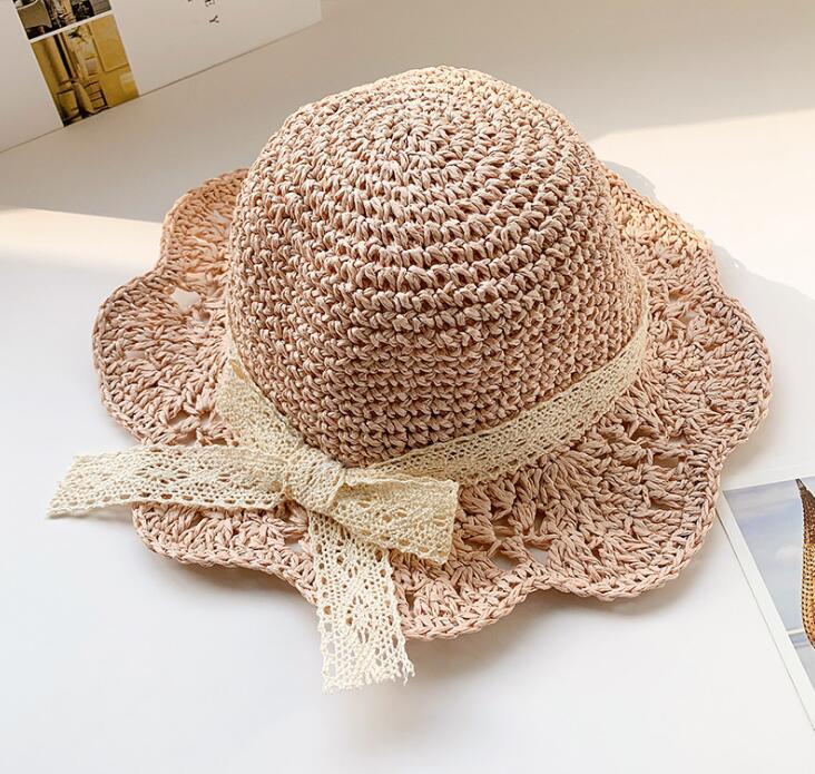 Summer baby hat: natural straw sun protector for infants, perfect for beach outings.