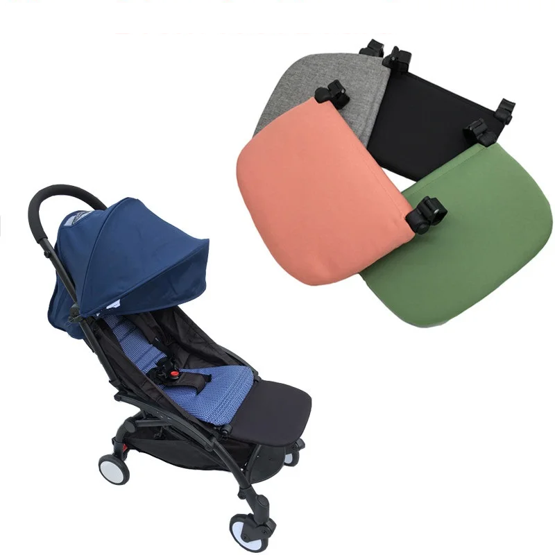 Baby stroller leg rest extension board, black, for toddler comfort during travel