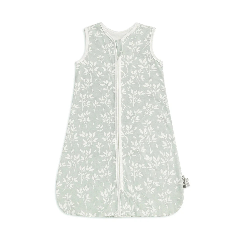 Adorably sleeping baby in a sleeveless cotton summer sleep sack, promoting safe and comfortable sleep.