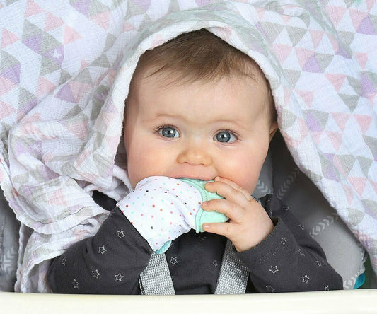 Baby Teething Mitten with green silicone soother, designed for infant comfort & pain relief