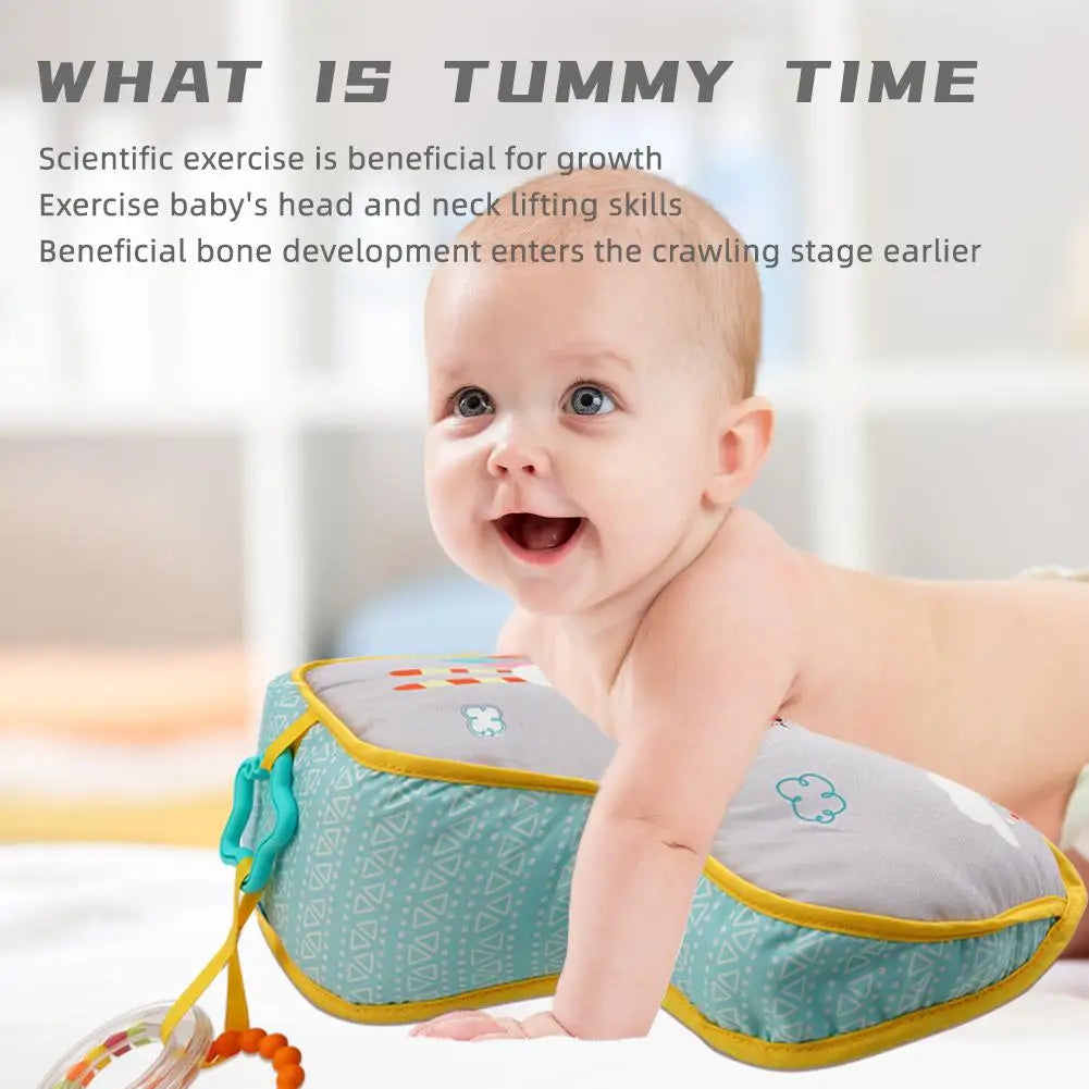 Infant tummy time pillow supporting newborn with attached sensory toys for early development and motor skills.