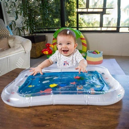 Close-up of a baby's tummy time water play mat showing vibrant corals and floating marine life for infants.