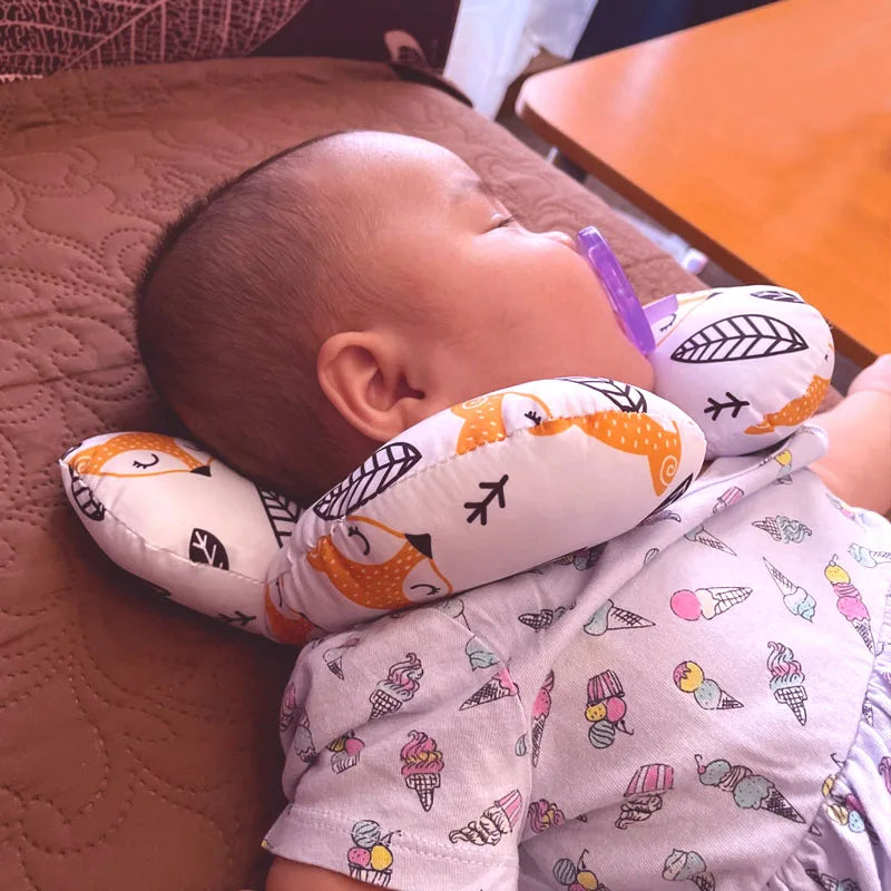 Close-up of U-shape baby travel pillow, breathable fabric, ideal for car seats and stroller accessory