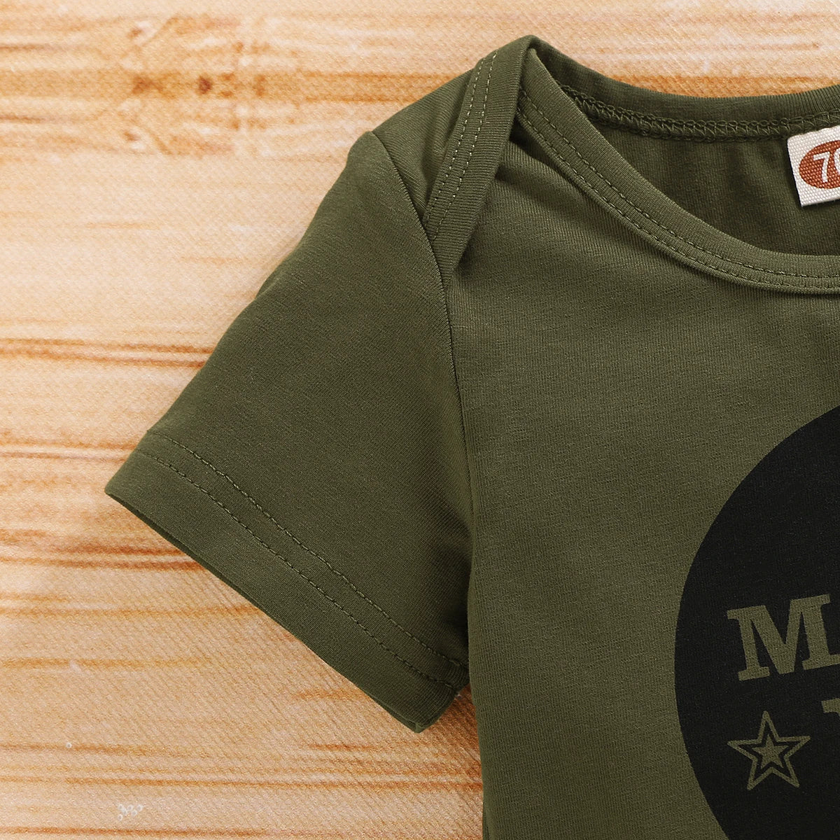 Cute baby gift: unisex newborn set with a camo print long-sleeve bodysuit and bottoms.