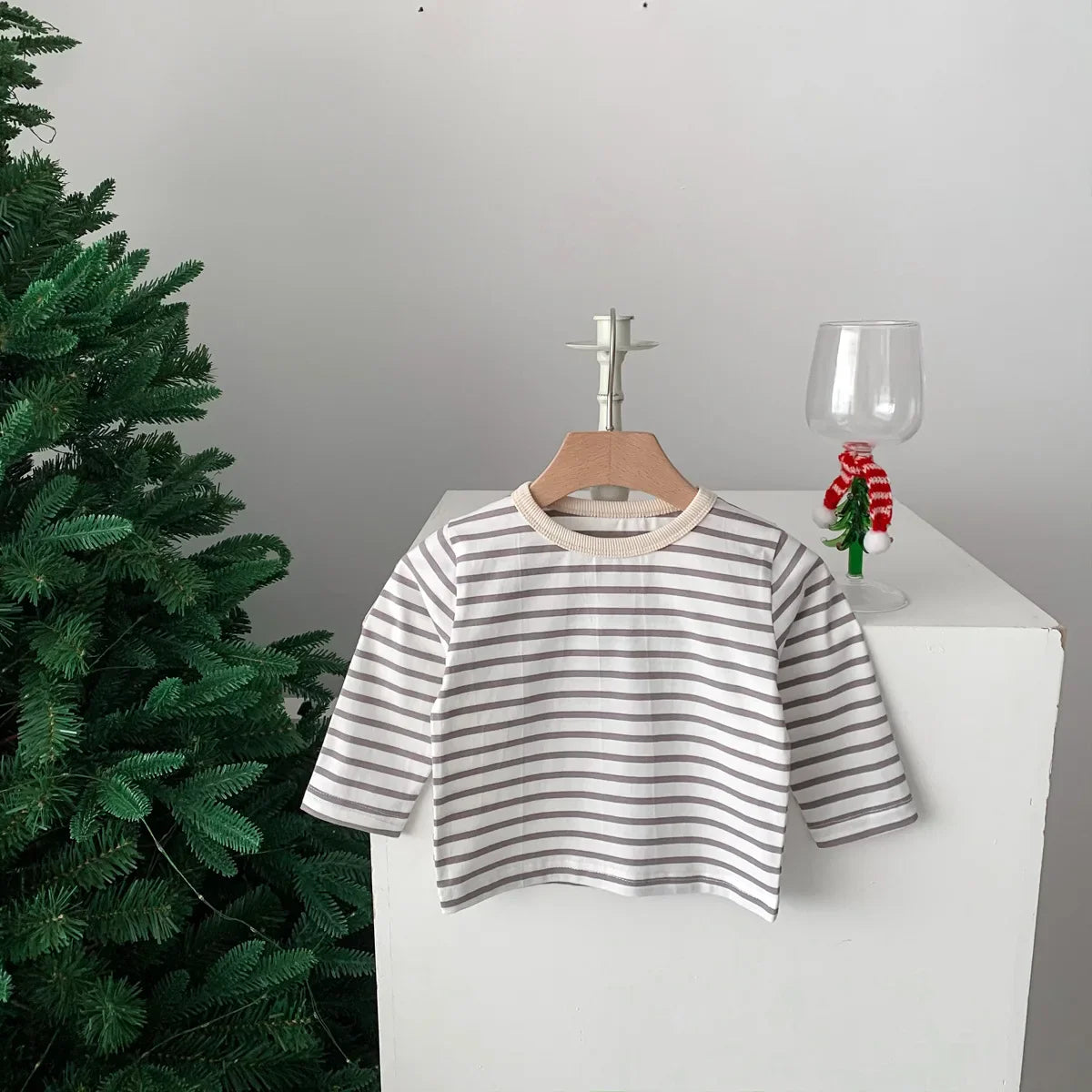 Baby clothing: simple plain white short sleeve cotton T-shirt, essential unisex item.