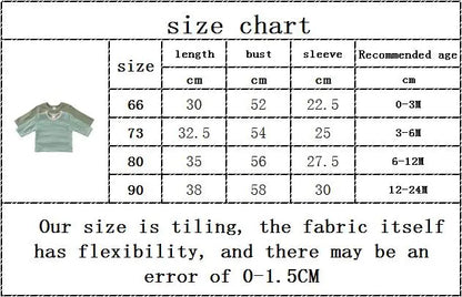Hanging display of various colors of plain cotton short sleeve unisex baby T-shirts.