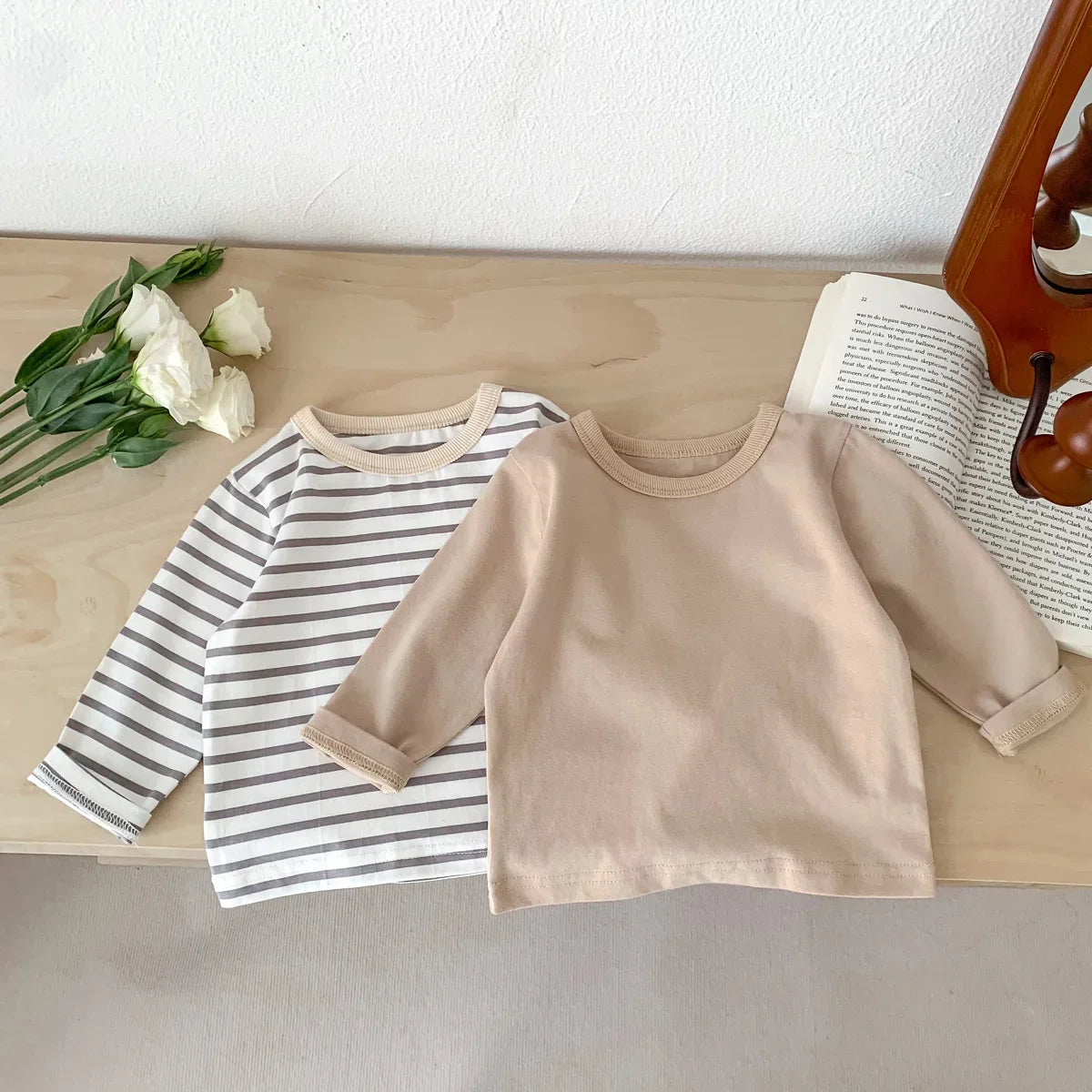 Newborn plain light blue cotton tee, a soft and simple unisex baby clothing option.