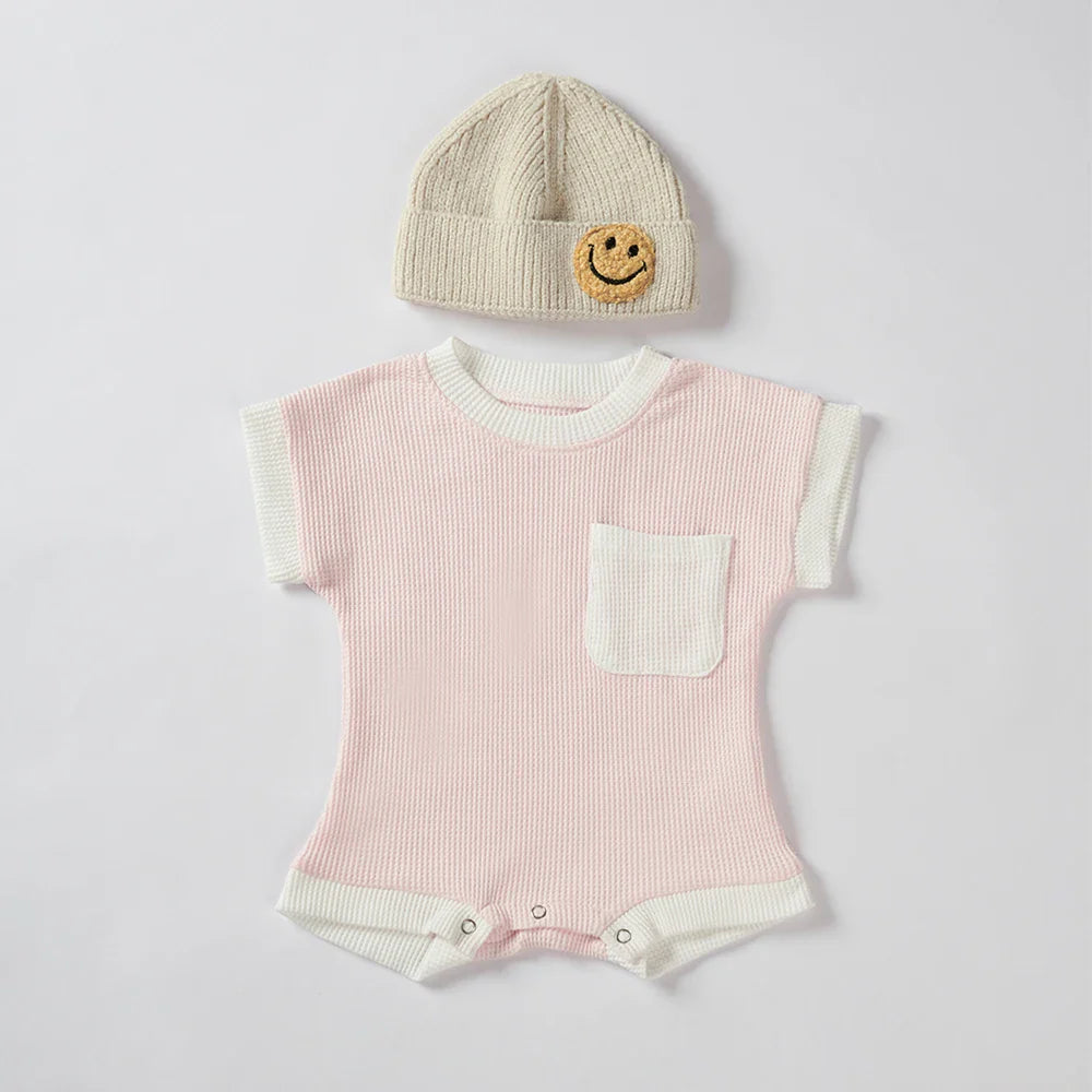 Breathable infant summer outfit: cotton waffle knit romper in a studio shot