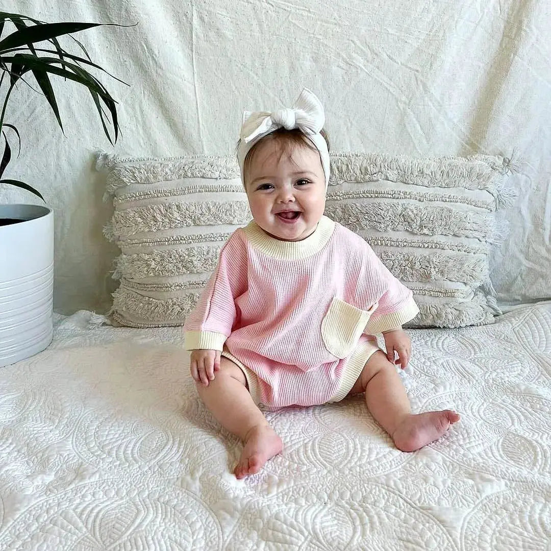 Unisex baby romper in a neutral color, breathable cotton for summer