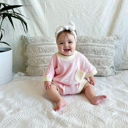 Unisex baby romper in a neutral color, breathable cotton for summer