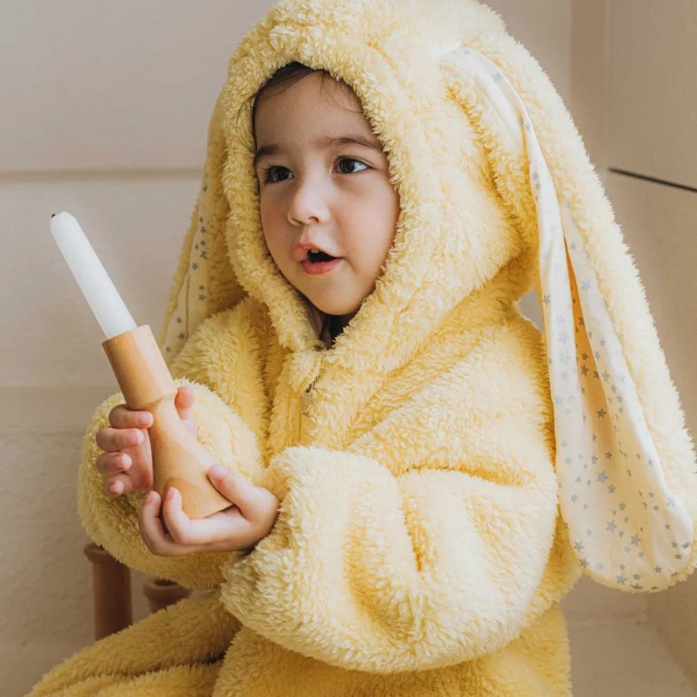 Full-body image of baby rabbit hooded romper, cozy winter sleepwear, gray unisex infant pajamas.