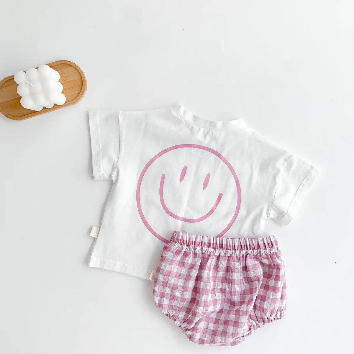 Baby outfit for warm weather: light smile face t-shirt and breathable plaid shorts