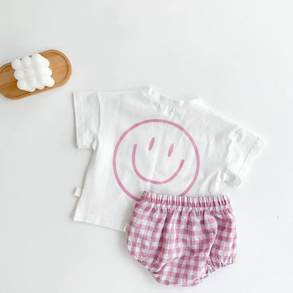Baby outfit for warm weather: light smile face t-shirt and breathable plaid shorts