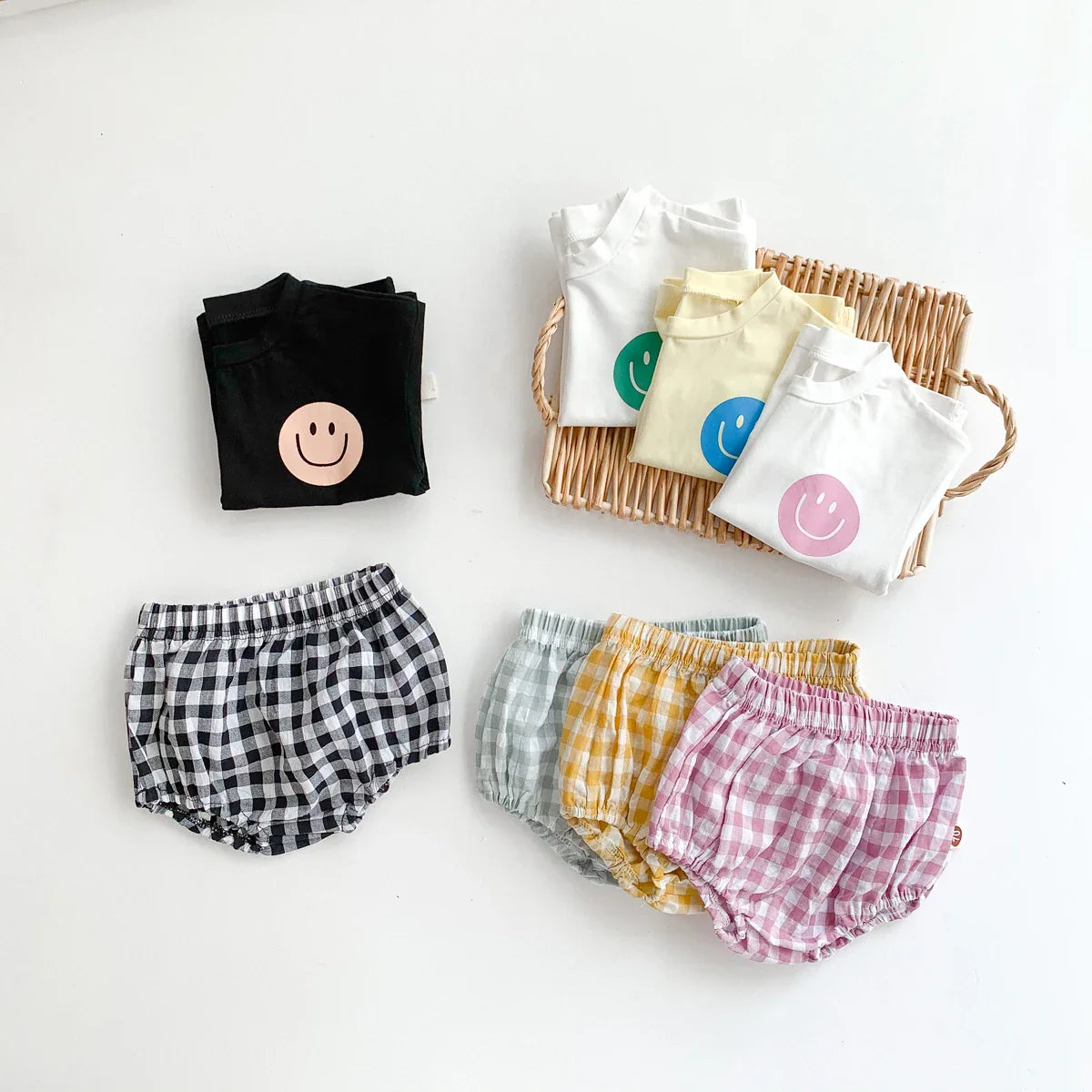 Stylish baby fashion: short-sleeve smile face t-shirt with trendy plaid shorts