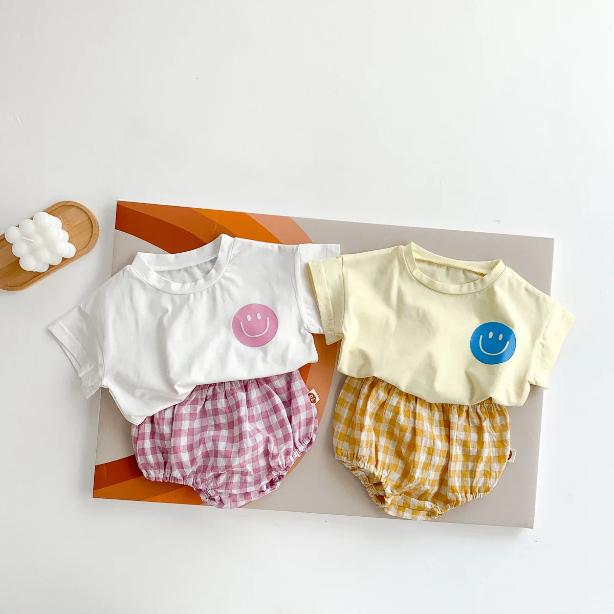 Two-piece baby set: white smile face t-shirt and blue plaid shorts for toddlers