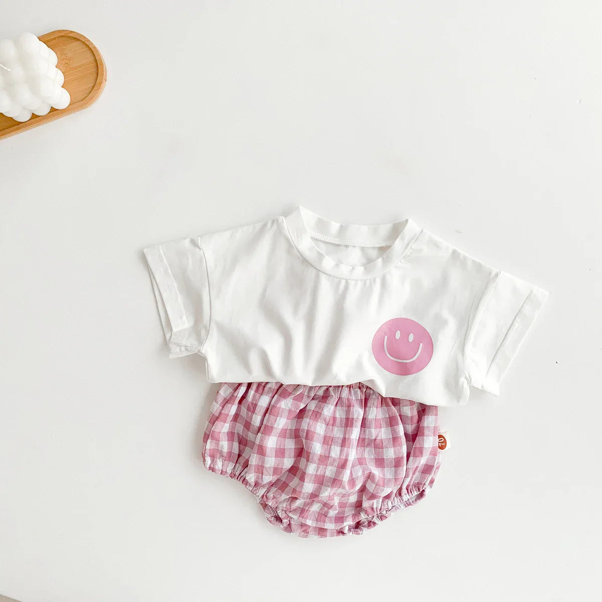 Infant apparel: adorable smile face t-shirt paired with matching plaid shorts