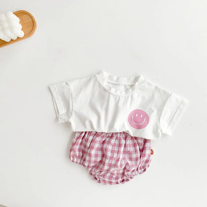Infant apparel: adorable smile face t-shirt paired with matching plaid shorts