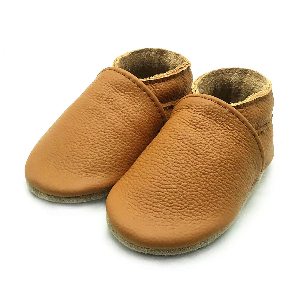 Side view of pink soft leather baby booties, comfortable and stylish infant footwear