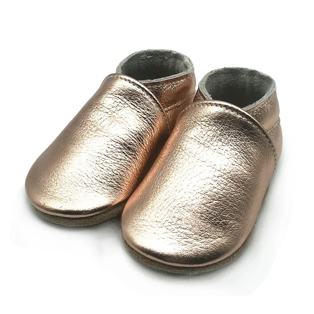 Top-down view of unisex soft sole leather booties, ideal baby accessories for infants