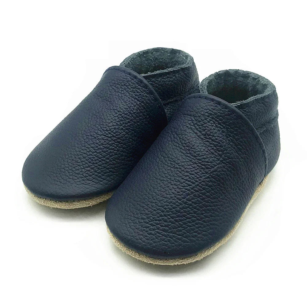 Unisex soft leather baby booties in various colors, essential newborn & infant footwear
