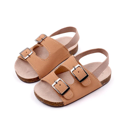 Unisex baby soft sole sandals in durable PU leather with secure dual buckles, ideal for summer fashion.