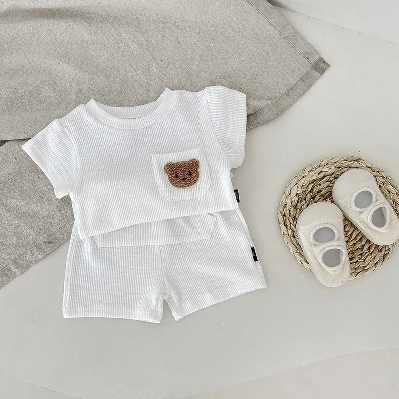 Baby clothing set featuring a white O-neck top with bear embroidery and coordinating shorts.