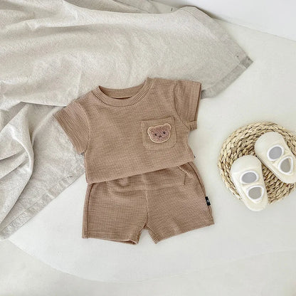 Toddler's adorable summer bear embroidery top and shorts set, perfect for warm weather.