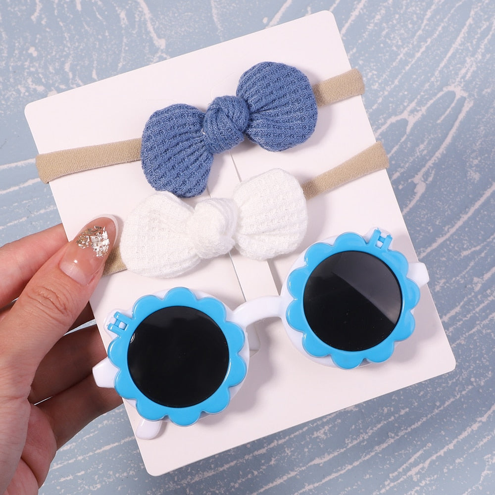 Lightweight baby UV protective sunglasses & bow. Easy to wear for infants & toddlers.
