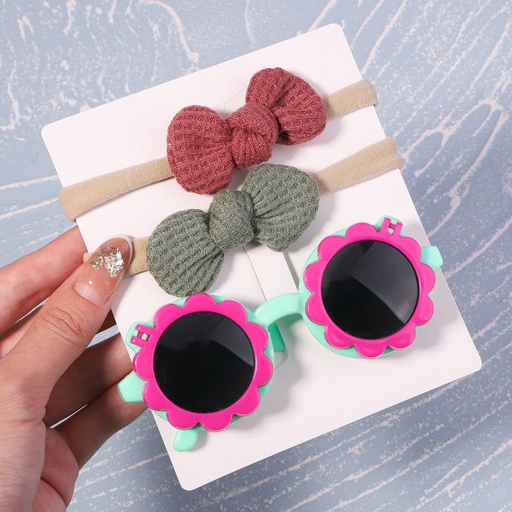 Toddler UV protective sunglasses & bow. Stylish sun protection for little ones, a must-have accessory.