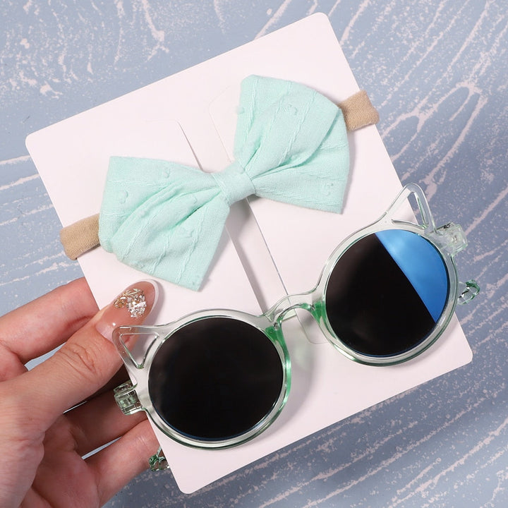 High-quality baby UV sunglasses with an adorable bow. Ideal for outdoor adventures & photos.