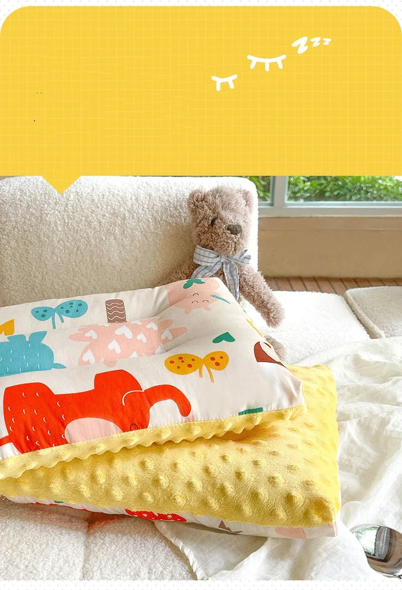 Cartoon print velvet baby pillow, perfect for adding a touch of fun and comfort to the nursery.