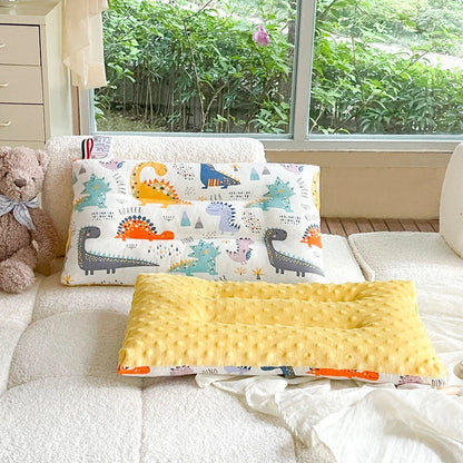 Infant sleep pillow in velvet, featuring a cute cartoon print, ideal for nursery bedding.