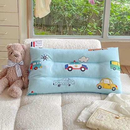 Nursery bedding essential: a soft velvet baby pillow with a charming cartoon pattern for comfort.