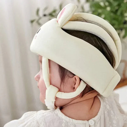 Crawling baby wearing a protective helmet, preventing bumps and bruises during play