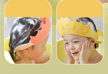 Child wearing a yellow no-tears shampoo bath cap, enjoying water without getting soap in eyes.