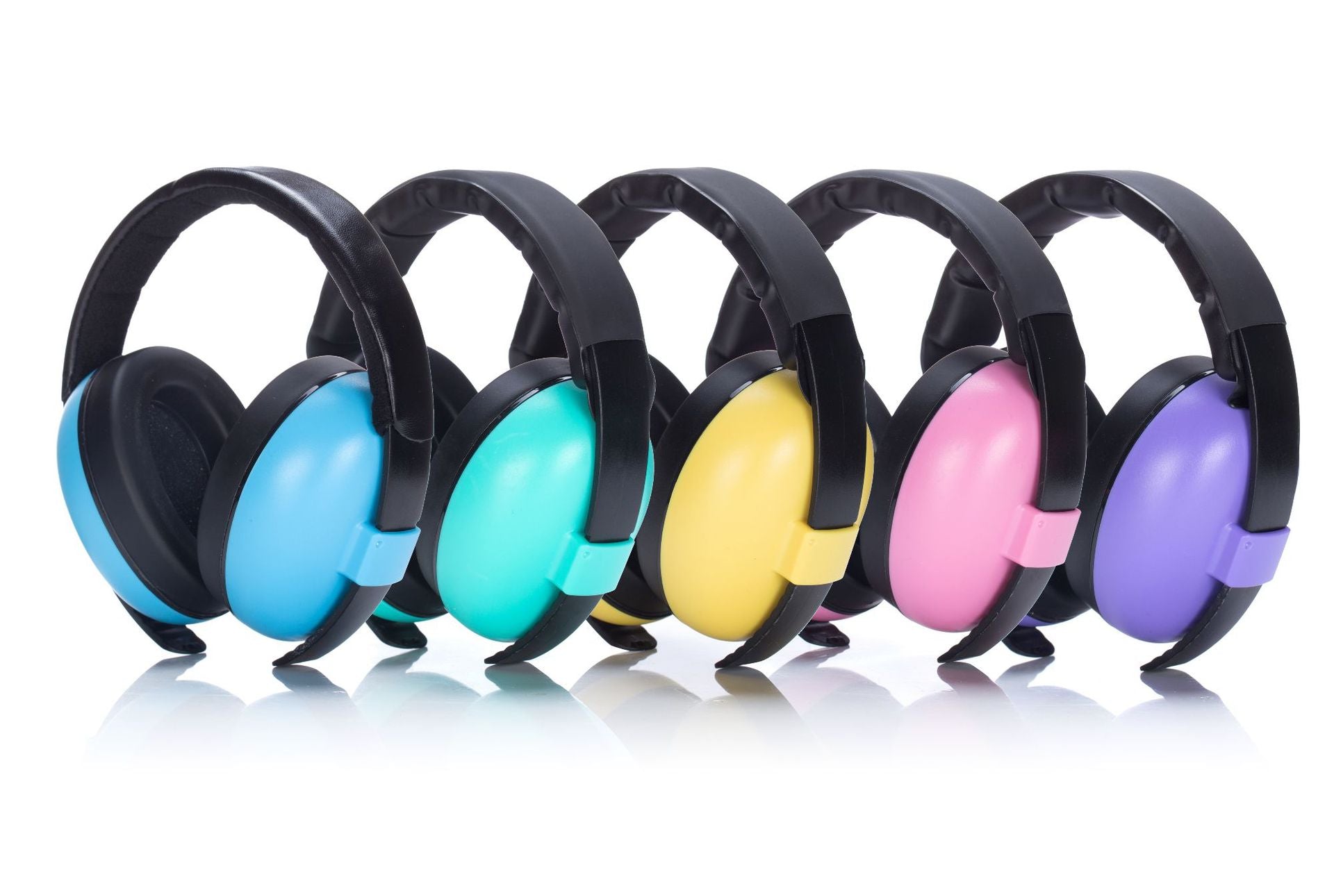 Stack of colorful baby earmuffs, showcasing variety of choices for infant noise protection.