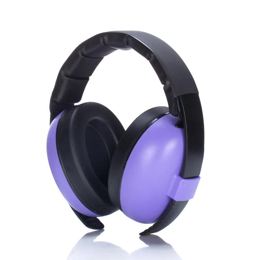 Side profile of an infant wearing blue noise cancelling earmuffs, protecting sensitive ears.