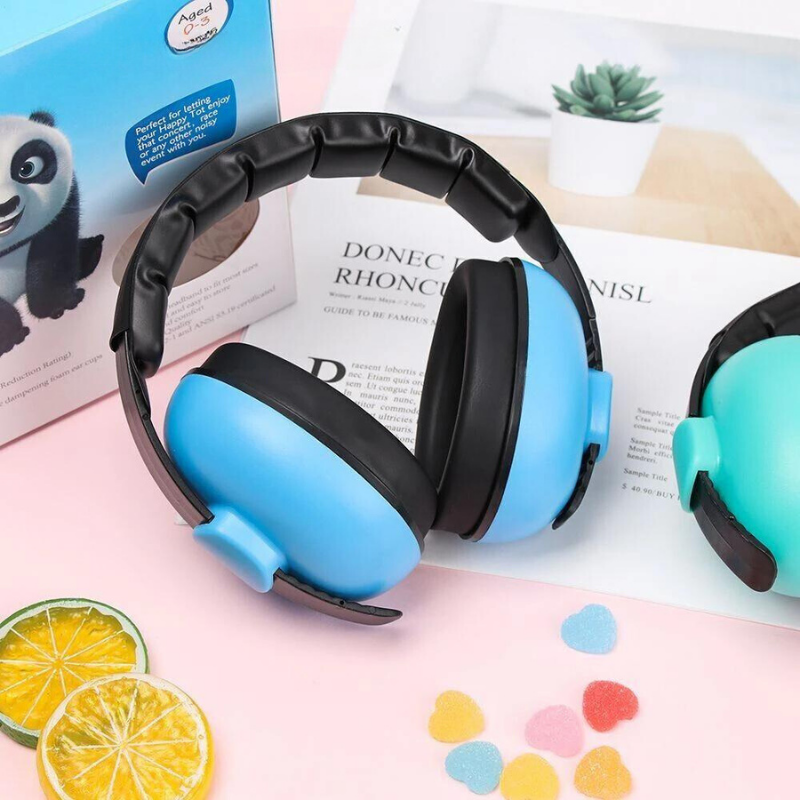 Baby wearing pink noise cancelling headphones, serene, perfect infant ear protection for sleep aid, safety gear.