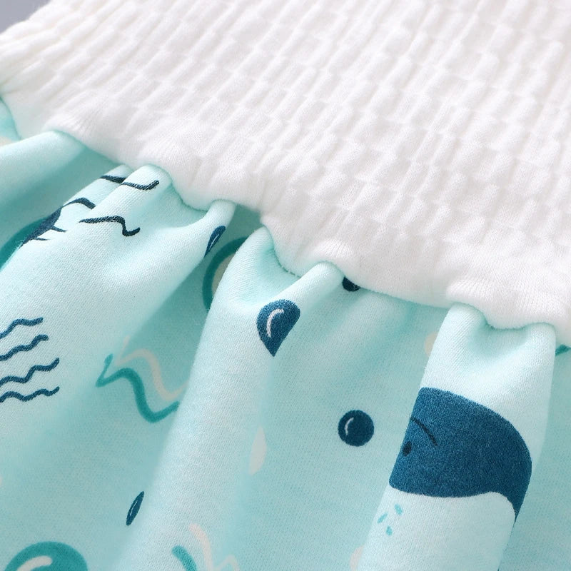 Mother changing baby into a comfortable reusable waterproof cotton diaper pant.