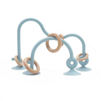 Stack of colorful wood ring silicone teethers, durable, easy to clean, essential infant soothing toy