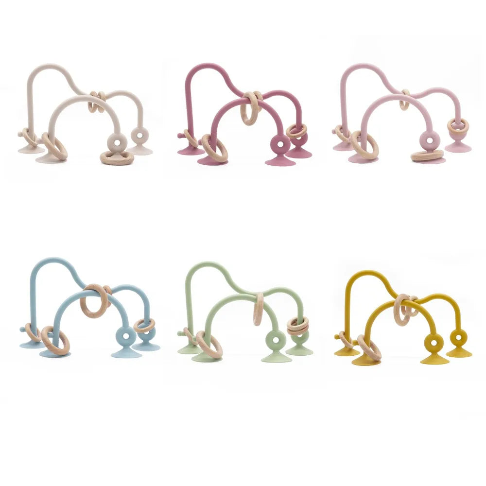 Close-up of baby wood ring teether with soft silicone, eco-friendly infant toy, newborn gift essentials