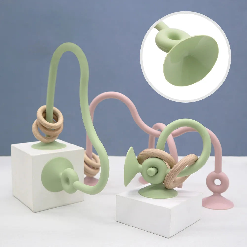 Ergonomic silicone teether with wooden ring for babies, promotes healthy oral development, soothing gums