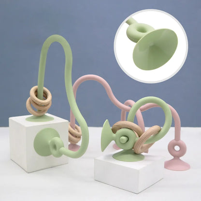 Ergonomic silicone teether with wooden ring for babies, promotes healthy oral development, soothing gums