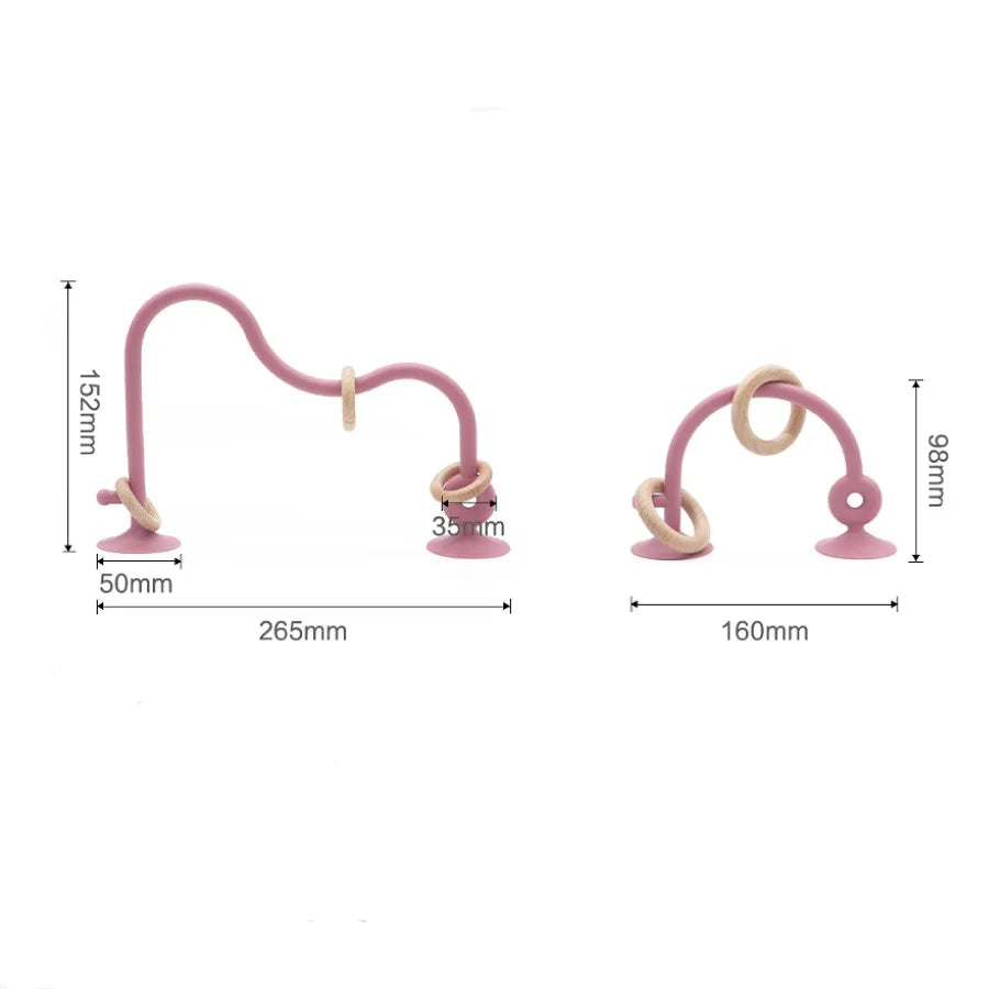 A baby's hand holding a wood ring silicone teether toy, ideal for grasping, infant soothing item
