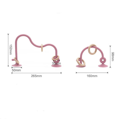 A baby's hand holding a wood ring silicone teether toy, ideal for grasping, infant soothing item