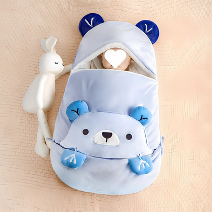 Baby wrapped in cozy cotton sleeping bag, neutral color, for comfortable sleep.