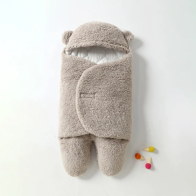Newborn's fleece swaddle, keeping baby warm and secure.