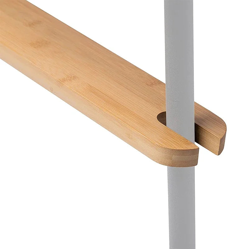 Close-up of a smooth wooden high chair footrest made from bamboo, designed for child safety & comfort.