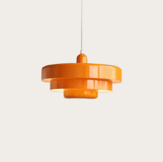 Bauhaus Metal LED Pendant Light in vibrant orange, green, and white with three-tier design illuminating a modern room.