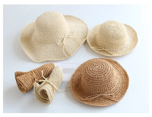 Beige foldable straw sun hat for children, ideal for beach & summer protection.
